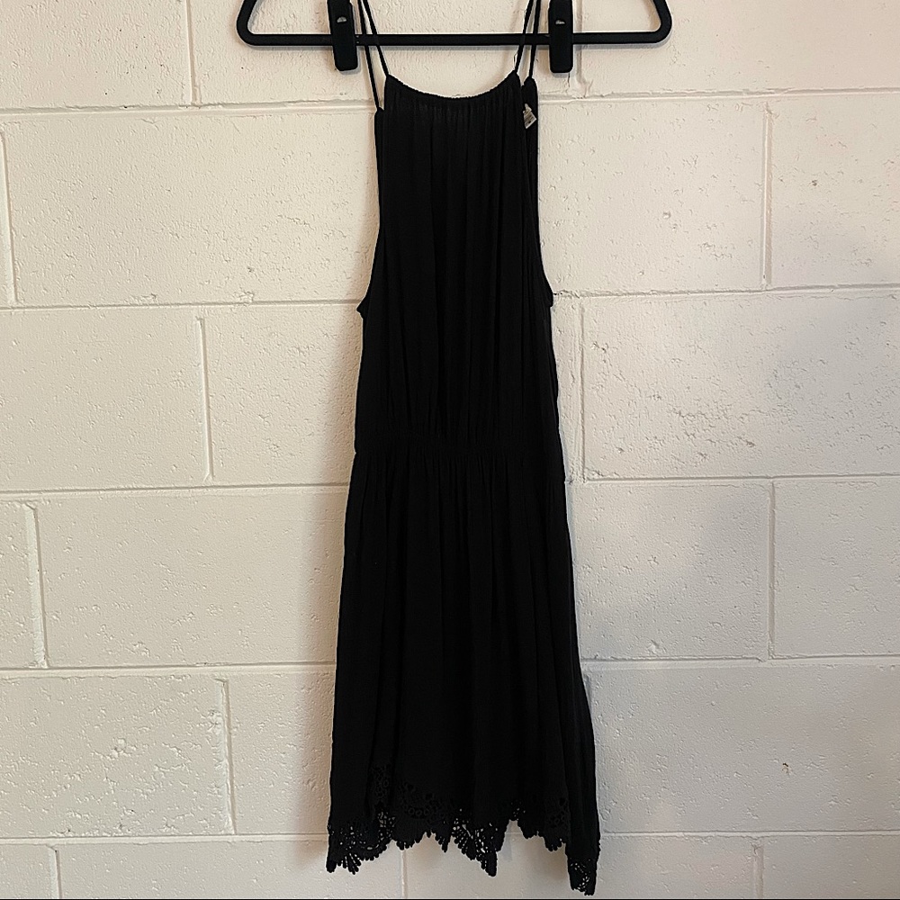 Black dress with draw string neck and lovely crochet hem line